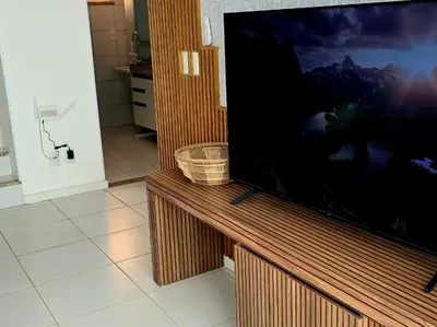 Uma televisão e/ou sistema de entretenimento em BEACH PARK PALM - COBERTURA Luxo