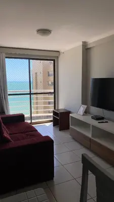 Uma televisão e/ou sistema de entretenimento em Flat Beira Mar Fortaleza