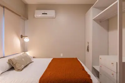 Uma cama ou camas num quarto em ECO FLECHEIRAS RESIDENCE