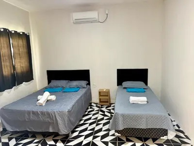 Uma cama ou camas num quarto em Casa no centro na Praia do Preá/CE