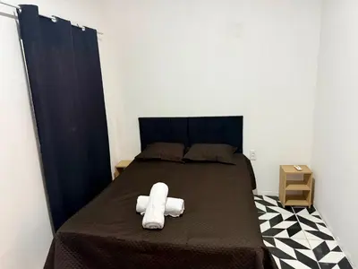 Uma cama ou camas num quarto em Casa no centro na Praia do Preá/CE