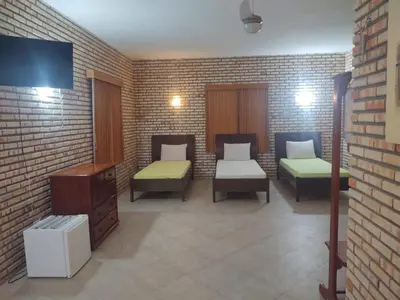 Uma cama ou camas num quarto em Pousada Solar das Fontes