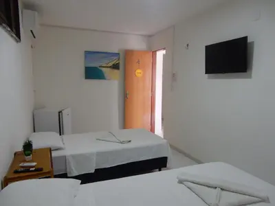 Uma cama ou camas num quarto em Pousada Ah Mar
