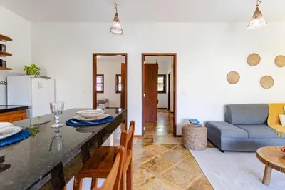 Uma área de estar em Apartamento Breezes