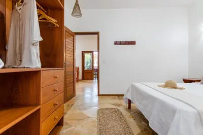 Uma cama ou camas num quarto em Apartamento Breezes