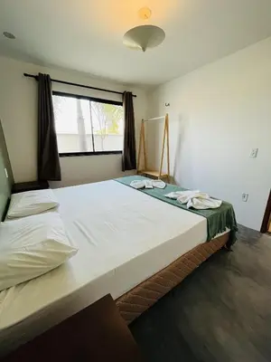 Uma cama ou camas num quarto em Aldeias Guajiru Apart