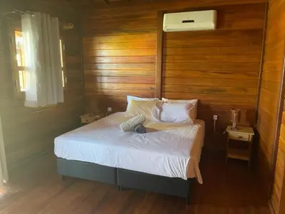 Uma cama ou camas num quarto em Pousada Wind Rose
