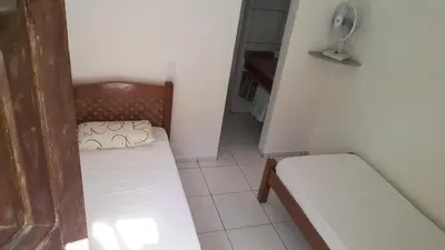 Uma cama ou camas num quarto em Hospedaria Chez Nous