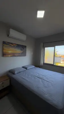 Uma cama ou camas num quarto em Residencial Nova Taíba CE com vista para o mar