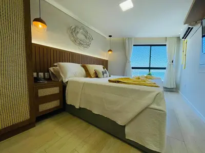 Uma cama ou camas num quarto em Flat Luxuoso Alto Padrao Frente Mar com 2 suites no Iate Plaza