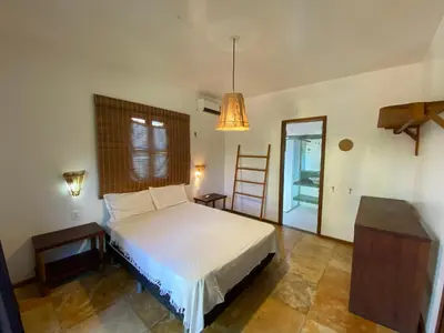 Uma cama ou camas num quarto em Condominio Vila dos Ventos
