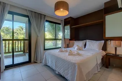 Uma cama ou camas num quarto em VG Sun #102 - Apto de Dois Quartos por Carpediem