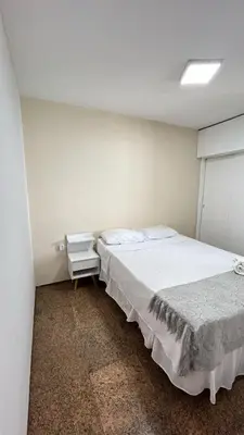 Uma cama ou camas num quarto em Flat Atlântico Neto