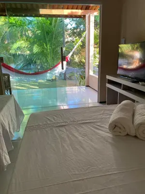Uma cama ou camas num quarto em Chalés toca do guaxinim