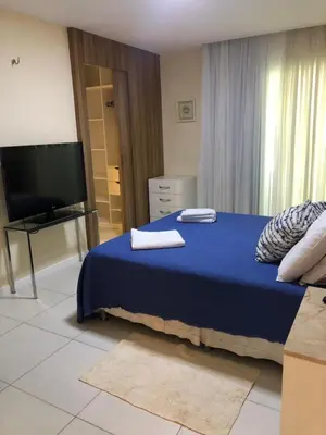 Uma cama ou camas num quarto em Apto de luxo no Golfville Ideal para família e home office Prox do Beach Park