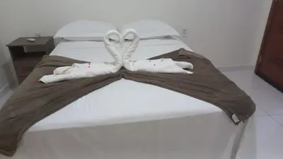 Uma cama ou camas num quarto em POUSADA SOLAR DOS MOREIRAS