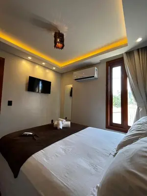 Uma cama ou camas num quarto em Milos Hotel Icaraizinho