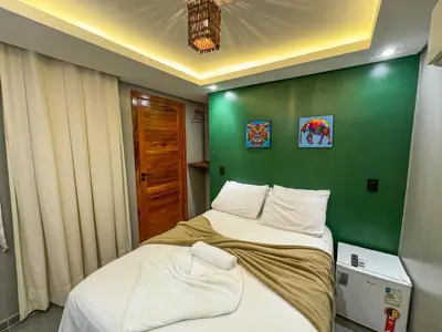 Uma cama ou camas num quarto em Milos Hotel Icaraizinho