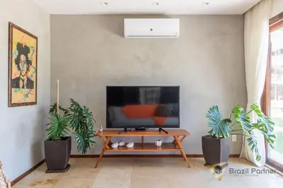 Uma televisão e/ou sistema de entretenimento em Apartamento 3 Suítes - Completo - Praia da Taíba