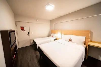 Uma cama ou camas num quarto em ibis Fortaleza Praia de Iracema