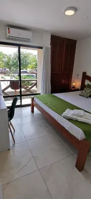 Uma cama ou camas num quarto em Peco Paradise Cumbuco Ap119
