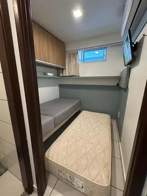 Uma cama ou camas num quarto em Apartamento Beira Mar 14º andar com 2 Quartos