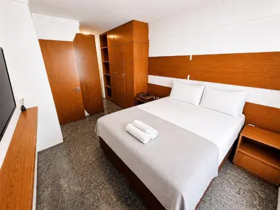 Uma cama ou camas num quarto em Hosts BR - Cobertura duplex frente mar