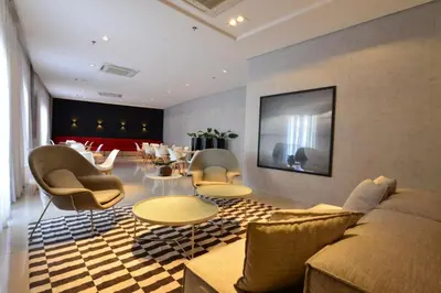Uma área de estar em Apartamento prox a Beira Mar