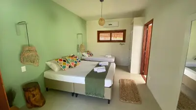 Uma cama ou camas num quarto em Casa Pura Vida - Icaraizinho