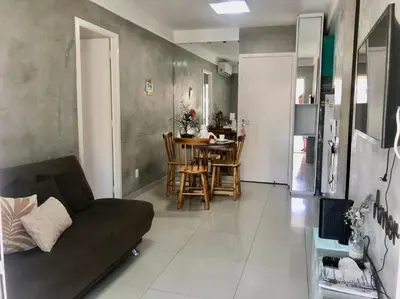 Uma área de estar em Apartamento Na Praia - VG FUn residence