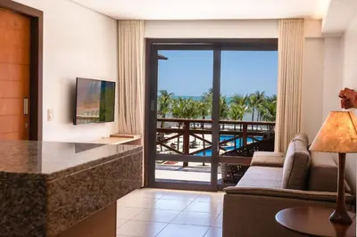 Uma televisão e/ou sistema de entretenimento em [KaririBeach319A] Flat 1q com vista maravilhosa
