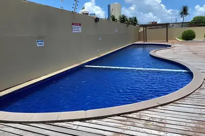 A piscina em ou perto de Hosts BR - Flat frente mar c/ cozinha