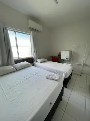 Uma cama ou camas num quarto em Hotel Letiva Centro