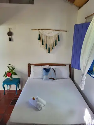 Uma cama ou camas num quarto em Chalé Flor do Ser
