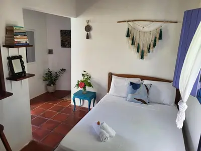 Uma cama ou camas num quarto em Chalé Flor do Ser