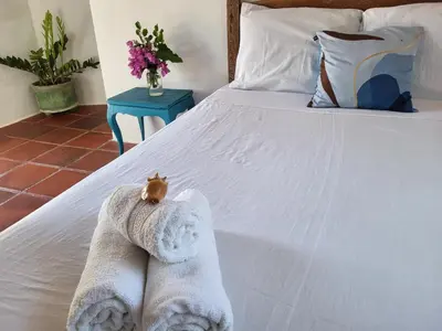 Uma cama ou camas num quarto em Chalé Flor do Ser