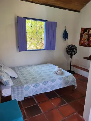 Uma cama ou camas num quarto em Chalé Flor do Ser