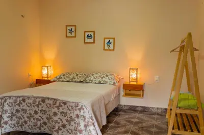 Uma cama ou camas num quarto em Garden´s Village