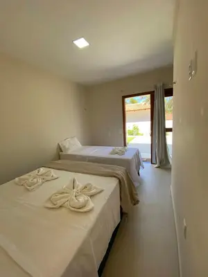 Uma cama ou camas num quarto em Pousada Vibe Guajiru