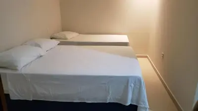 Uma cama ou camas num quarto em Pousada Vibe Guajiru