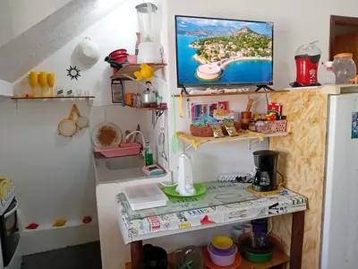 A cozinha ou kitchenette de Chale Canoa Beach