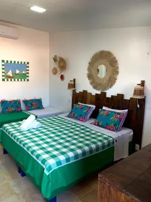 Uma cama ou camas num quarto em Maria Flor Pousada