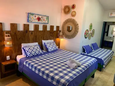 Uma cama ou camas num quarto em Maria Flor Pousada