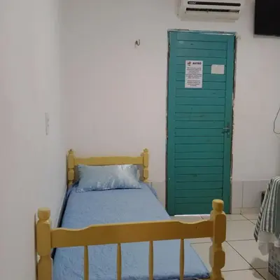 Uma cama ou camas num quarto em Hospedagens Icapui Mare Blu