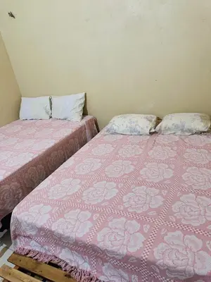 Uma cama ou camas num quarto em Casa 2 Gold Star Village