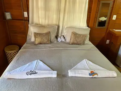 Uma cama ou camas num quarto em Pousada BANGALÔS SOL DE LAGOINHA
