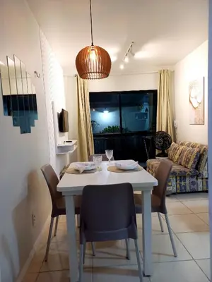 Uma televisão e/ou sistema de entretenimento em Apartamento Porto das Dunas