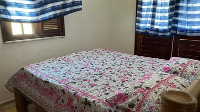 Uma cama ou camas num quarto em TAIBA - ONDAS DO MAR RESIDENCE Ap 212 - Rezende Temporada