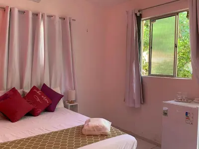 Uma cama ou camas num quarto em Happy Hostel e Pousada Paracuru