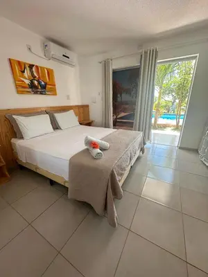 Uma cama ou camas num quarto em Milano Hotel Pousada Canoa Quebrada
